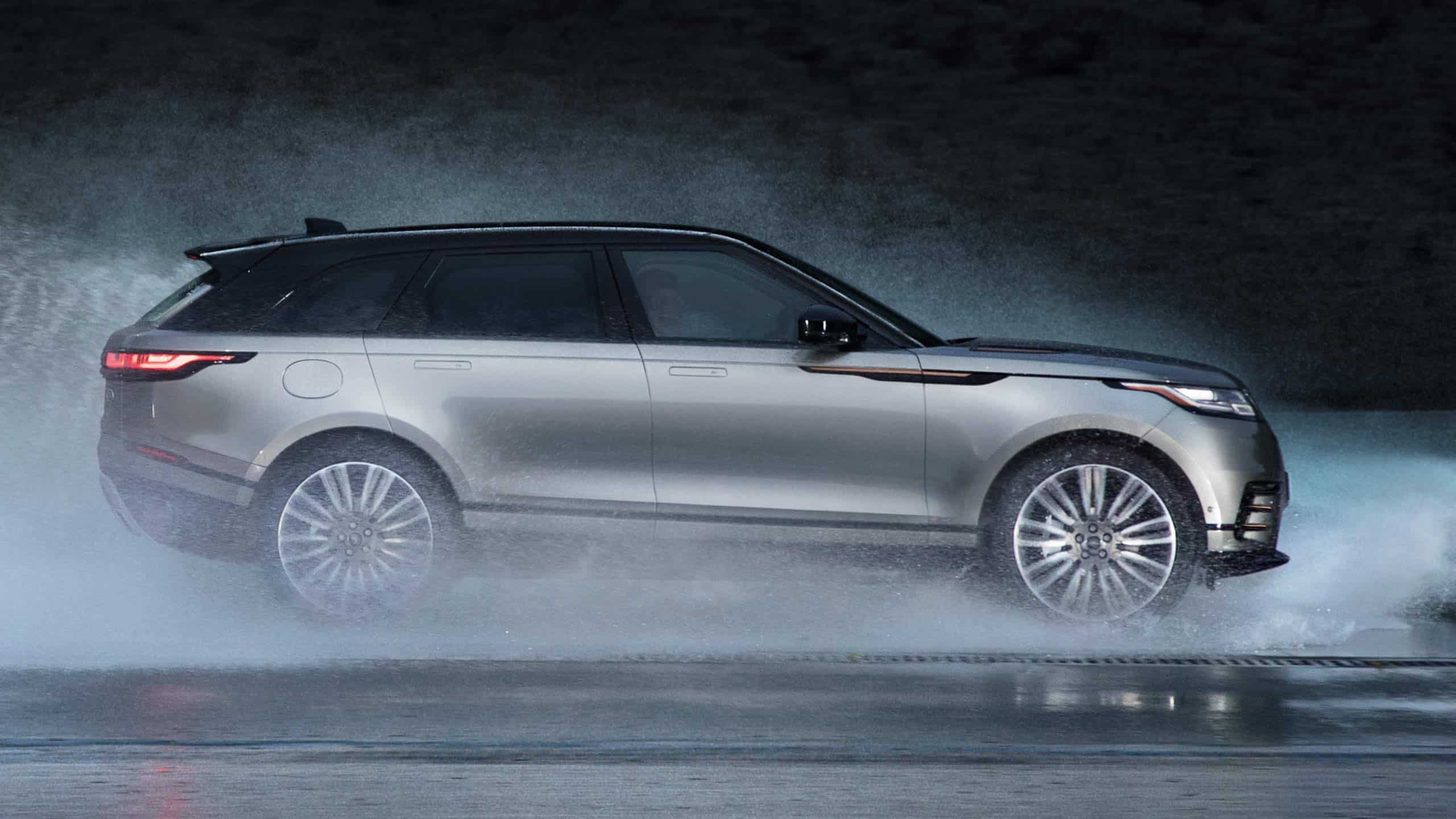Range Rover Velar profile view driving in rain