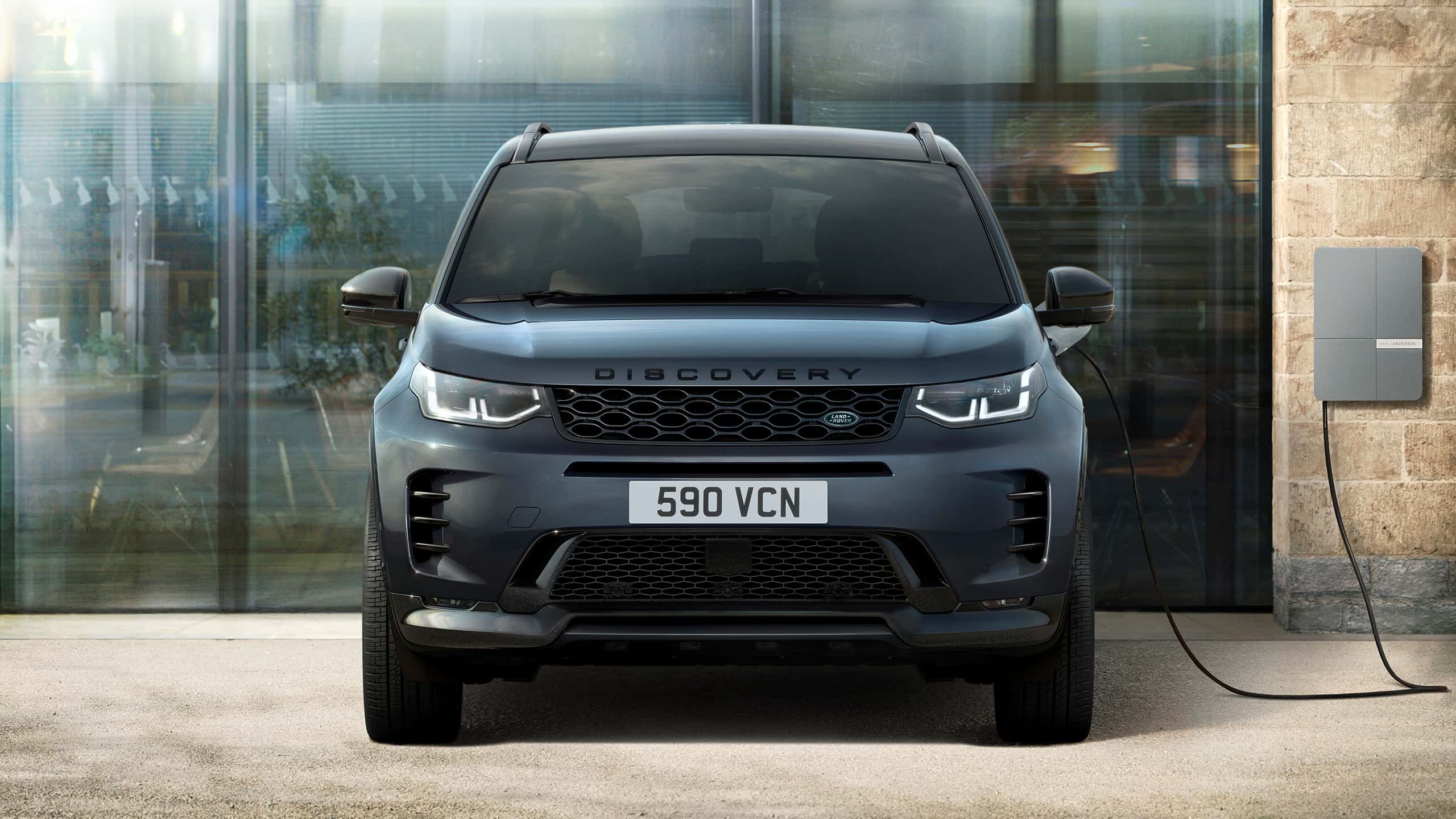 Discovery parked on EV charging station