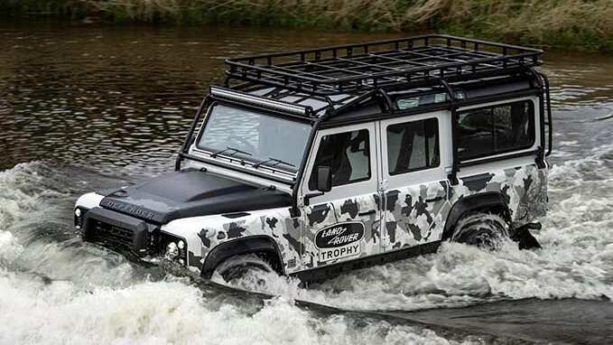 Classic Defender driving through a river