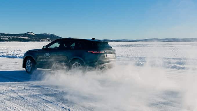 Range Rover driving in snow